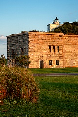 Sun Setting by Clarks Point Light on Fort Taber